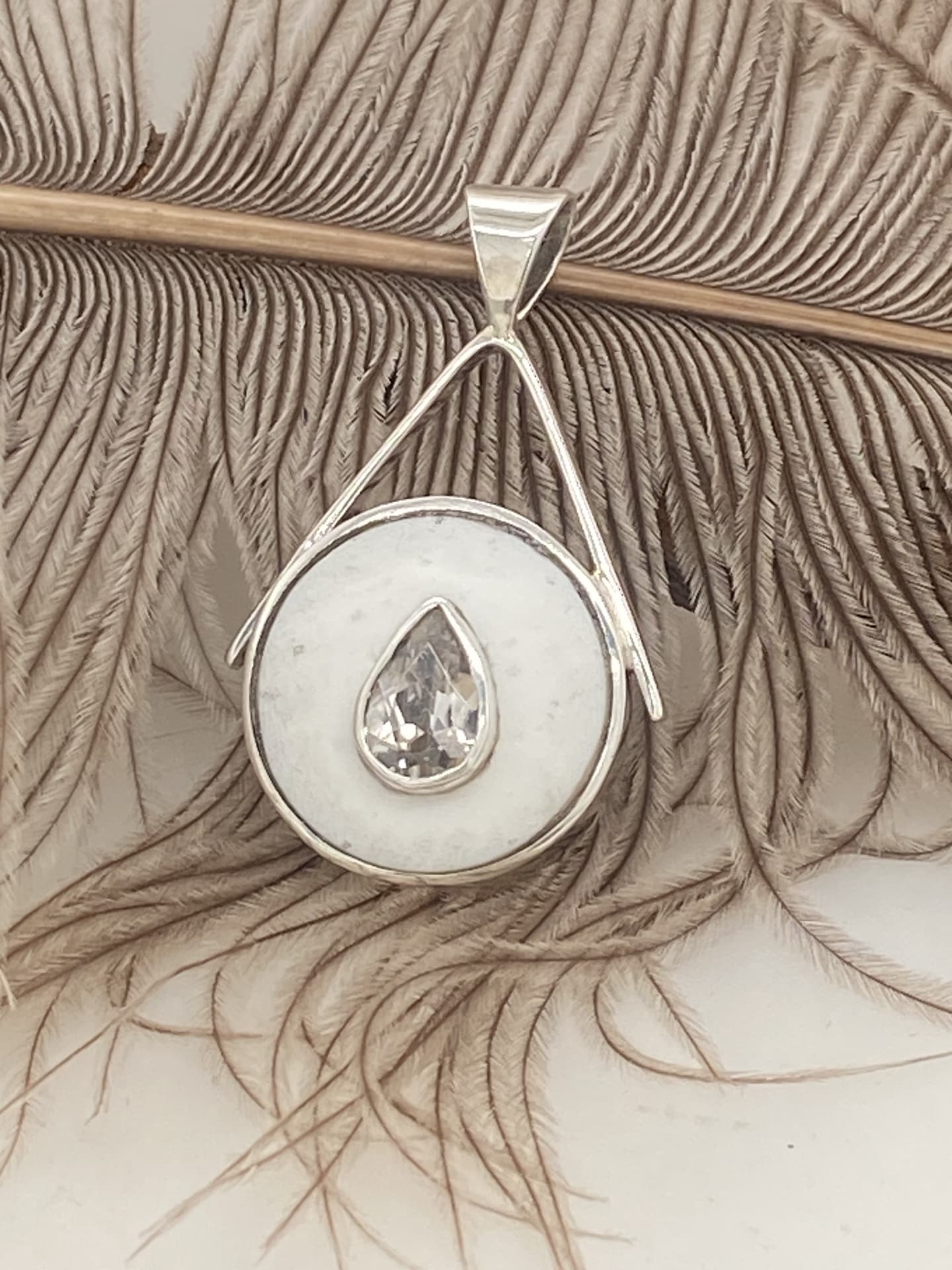 S.S Ostrich Eggshell Pear Shaped Pendant with 2.06Cts Morganites.